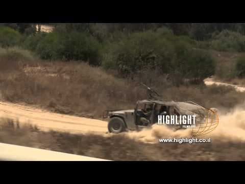 TZE 019 IDF Srock footage Israel, Operation Protective Edge 2014: Humvee rushing into Gaza Strip