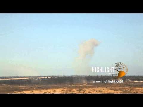 TZE 030 Stock footage Israel: Long shots of Gaza with smoke following aerial strikes
