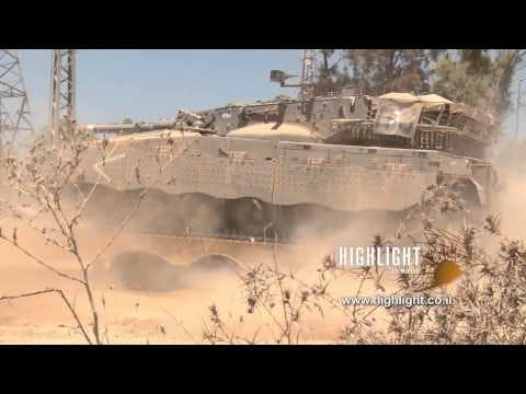 TZE 023 Stock footage of Gaza War: Loading a Merkava tank on a truck + driving away