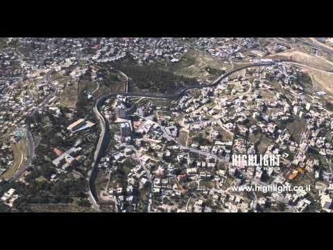 AJ4K 026 - Aerial 4K footage of Jerusalem: The security wall around east Jerusalem and Abu Dis