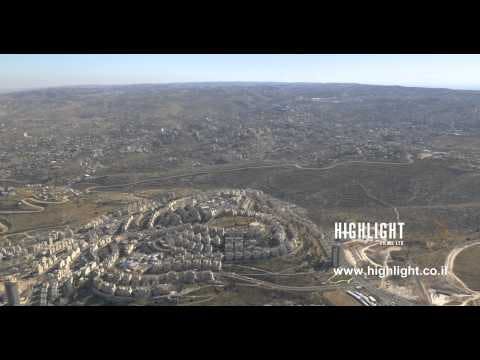AJ4K 035 - Aerial 4K footage of Jerusalem: Neighborhood of Har Homa, separation wall, Beit Sahour