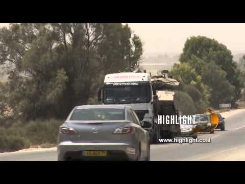 TZE 017 Stock footage Israel, Operation Protective Edge 2014: Trucks carrying tanks to the front