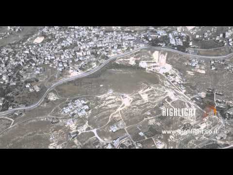 AJ4K 025 - Aerial 4K footage of Jerusalem: The security wall around south Jerusalem
