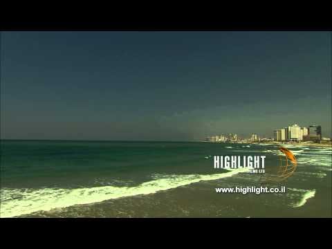 T 001 Israel Footage library: Tel Aviv stock footage - pan right from sea to shore.