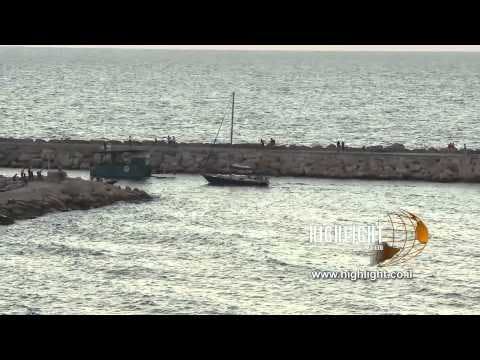T 052 Israel Footage library: Tel Aviv footage - pan left over breakwater near the Tel Aviv coast