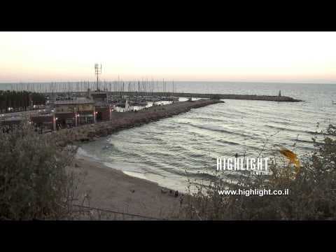 T 053 Israel Footage library: Tel Aviv footage - pan left over Tel Aviv marina and breakwater