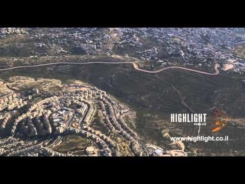 AJ4K 037 - Aerial 4K footage of Jerusalem: Neighborhood of Har Homa, separation wall, Beit Sahour